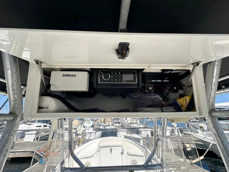 Slide: The Image of 2004 Fountain 31 Tournament Edition boat console with Simrad electronics at marina. - 10