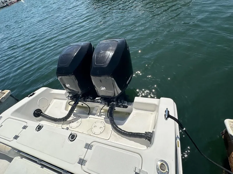 Slide: The Image of 2004 Fountain 31 Tournament Edition boat with dual outboard engines on water. - 7