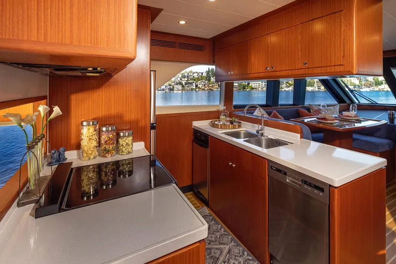 Slide: The Image of Luxurious interior of 2025 Apollonian Yachts 52 Pilothouse with modern kitchen and dining area. - 14