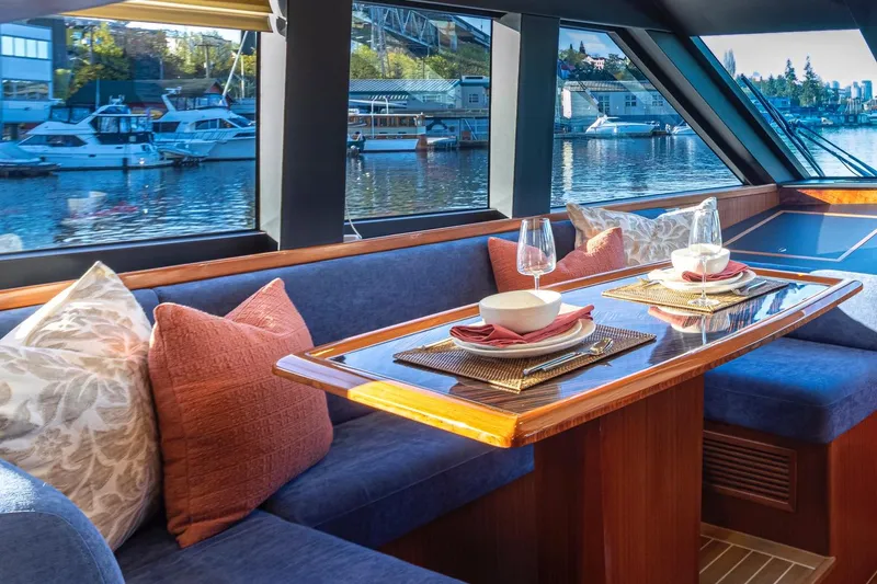 Slide: The Image of Luxurious interior of 2025 Apollonian Yachts 52 Pilothouse with elegant dining setup. - 15