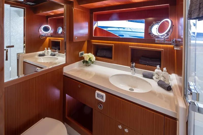 Slide: The Image of Luxurious bathroom in 2025 Apollonian Yachts 52 Pilothouse, featuring elegant wood finishes. - 19