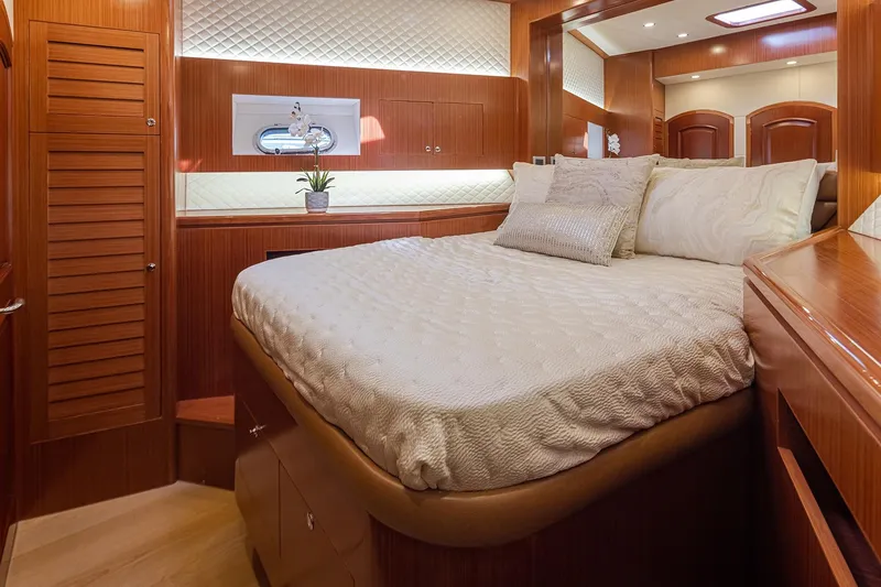 Slide: The Image of Luxurious bedroom interior of 2025 Apollonian Yachts 52 Pilothouse, featuring elegant wood finishes. - 21