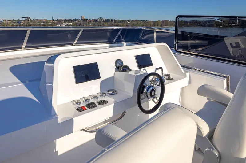 Slide: The Image of Pilothouse of 2025 Apollonian Yachts 52, featuring modern controls and dual screens. - 6