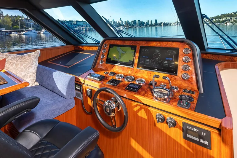 Slide: The Image of Luxurious 2025 Apollonian Yachts 52 Pilothouse helm with advanced navigation systems and waterfront view. - 16