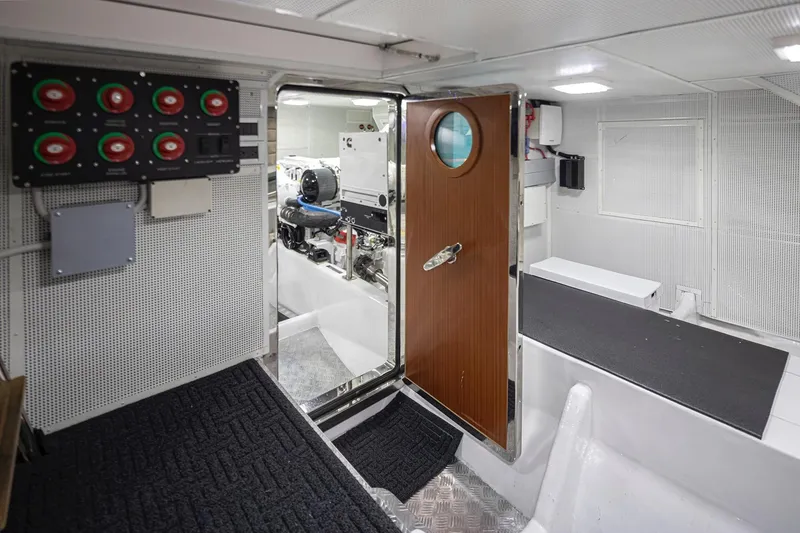 Slide: The Image of Engine room of 2025 Apollonian Yachts 52 Pilothouse, featuring control panel and equipment. - 8