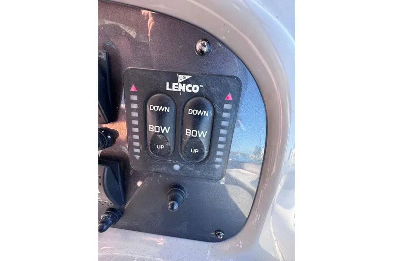 Slide: The Image of Control panel of 2014 Robalo R265 Walkaround boat with Lenco trim tab switches. - 32
