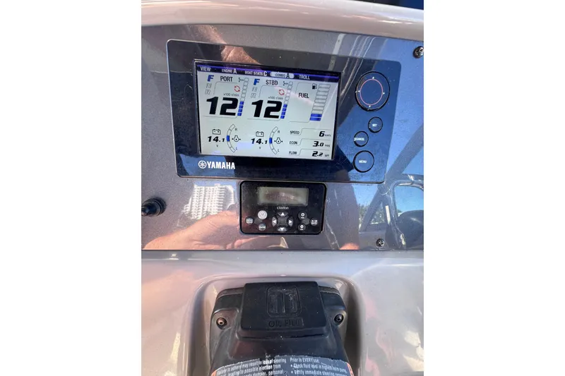 Slide: The Image of Yamaha display on 2014 Robalo R265 Walkaround boat dashboard showing engine stats. - 33