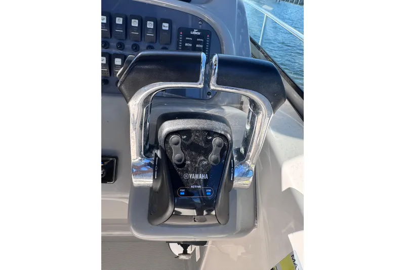 Slide: The Image of Throttle controls on a 2014 Robalo R265 Walkaround boat, featuring Yamaha engine controls. - 35