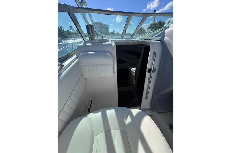 Slide: The Image of 2014 Robalo R265 Walkaround boat interior with seating and cabin entrance. - 37