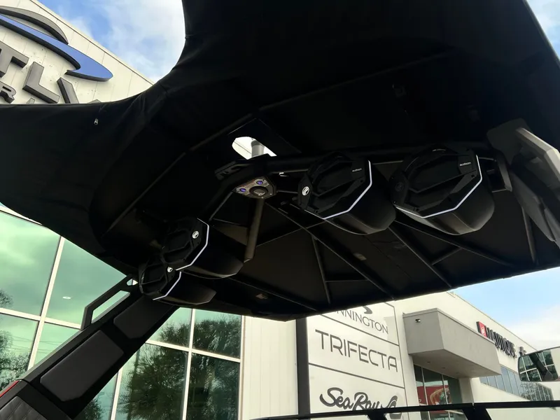 Slide: The Image of 2026 Tigé 24RZX boat speakers and canopy at dealership. - 12
