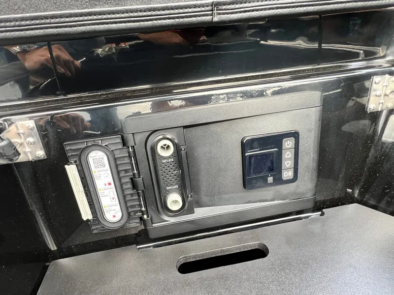 Slide: The Image of Control panel of a 2026 Tigé 24RZX boat, featuring inflate and deflate options. - 19