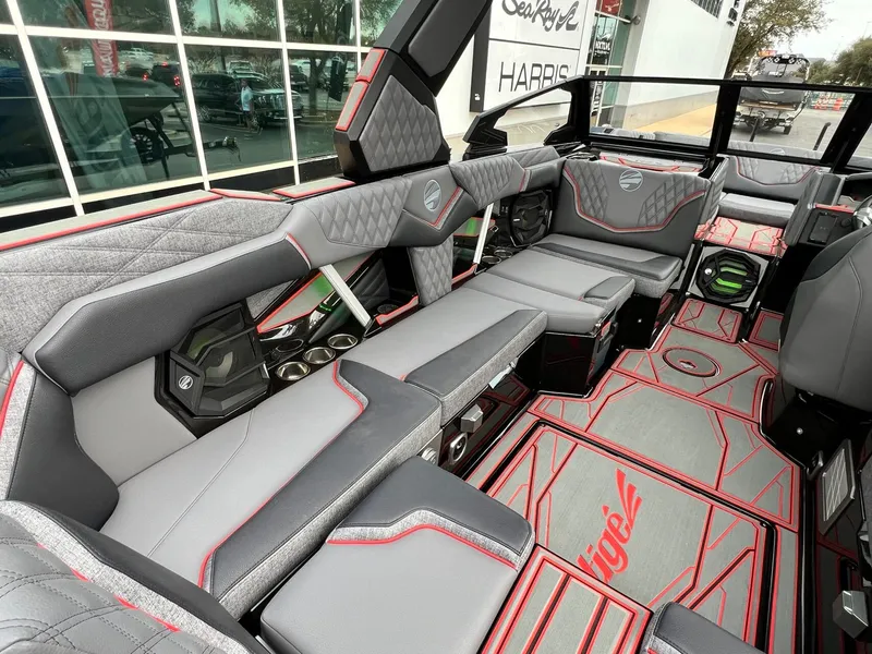 Slide: The Image of 2026 Tigé 24RZX boat interior with modern seating, red accents, and stylish design. - 21
