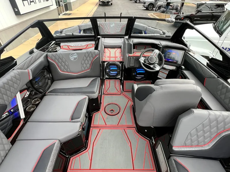 Slide: The Image of 2026 Tigé 24RZX boat interior with modern dashboard, plush seating, and sleek design. - 23