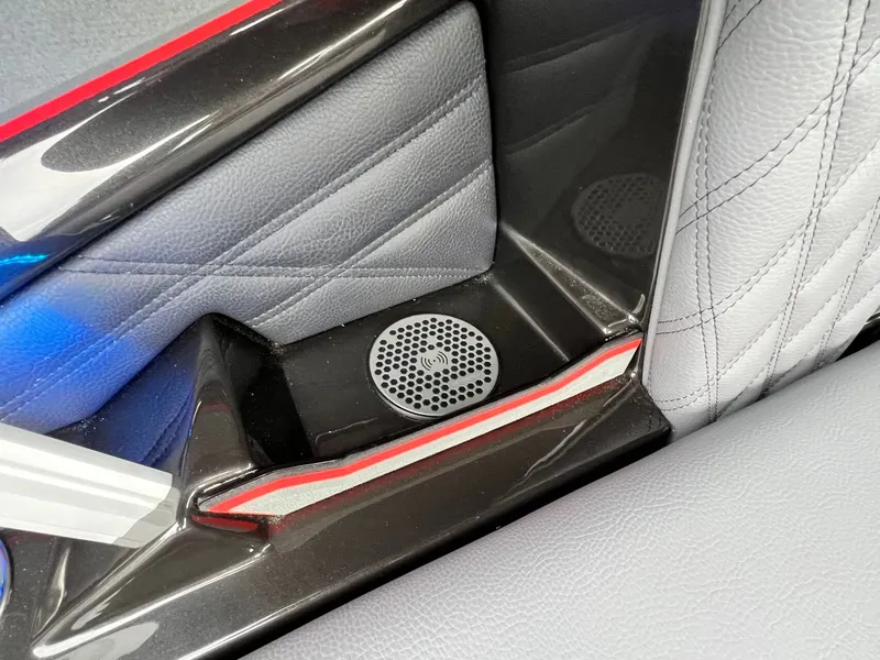 Slide: The Image of Interior detail of 2026 Tigé 24RZX boat, featuring sleek design and speaker system. - 27