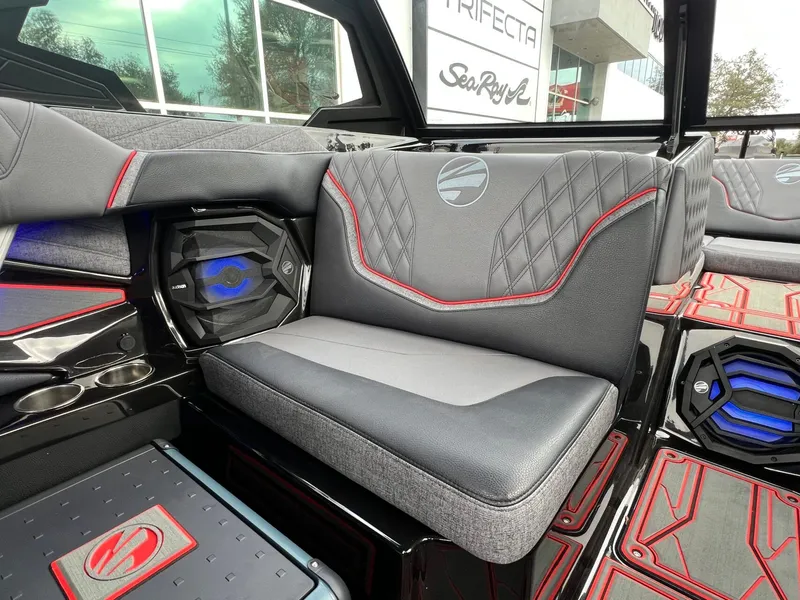 Slide: The Image of 2026 Tigé 24RZX boat interior with stylish seating and modern speaker system. - 30