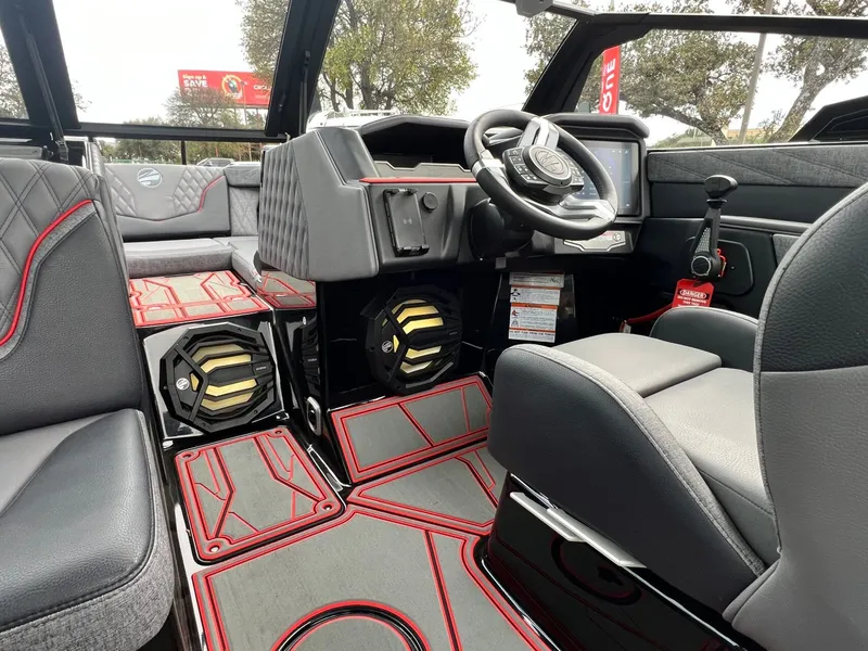 Slide: The Image of 2026 Tigé 24RZX boat interior with modern dashboard, steering wheel, and stylish seating. - 31