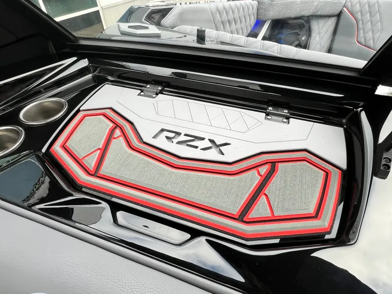 Slide: The Image of 2026 Tigé 24RZX boat interior with stylish RZX branding and cup holders. - 38