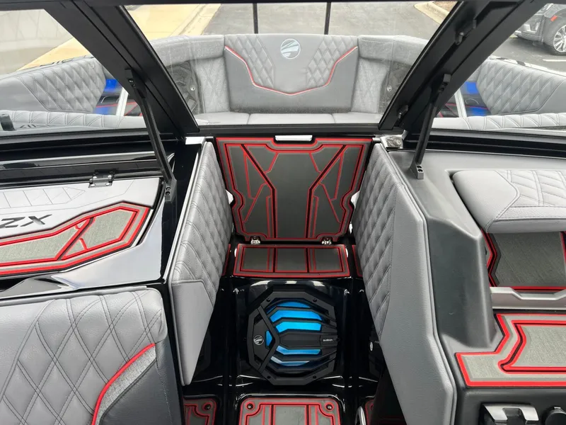 Slide: The Image of Interior of 2026 Tigé 24RZX boat with modern design and red accents. - 46