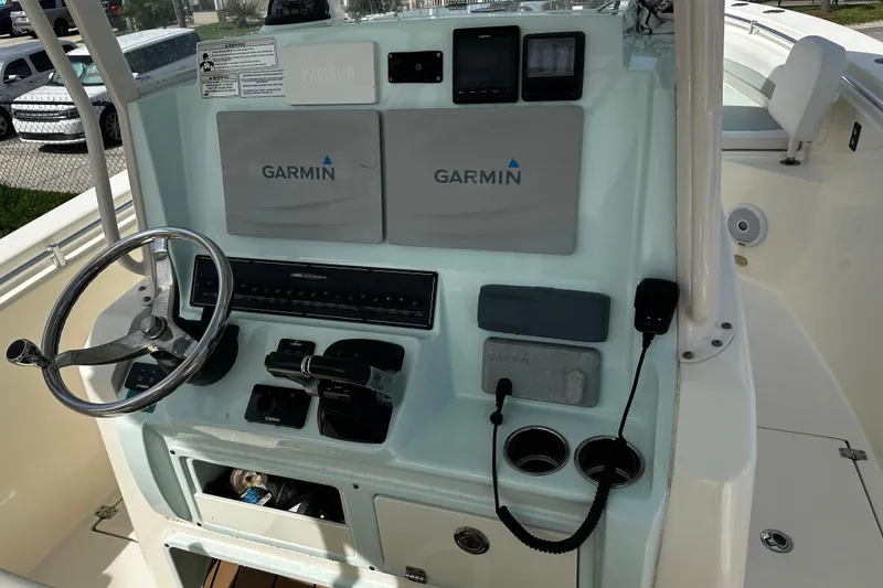 Slide: The Image of 2018 Cobia 301 Center Console boat dashboard with Garmin navigation system. - 2
