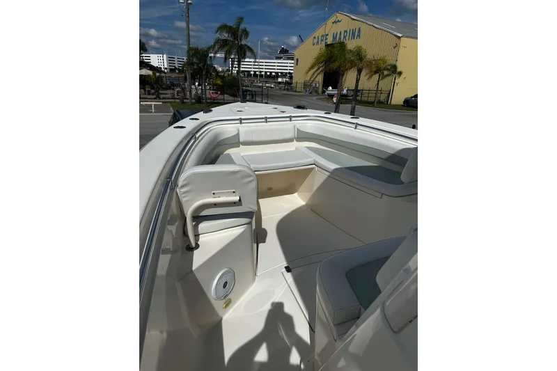 Slide: The Image of 2018 Cobia 301 Center Console boat interior at Cape Marina, featuring spacious seating. - 8