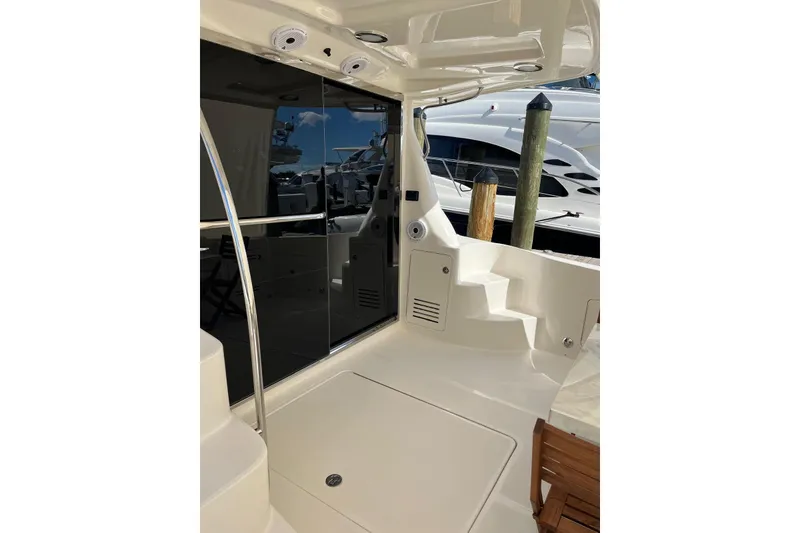 Slide: The Image of 2006 Sea Ray 52 Sedan Bridge yacht deck with sleek design and modern amenities. - 14