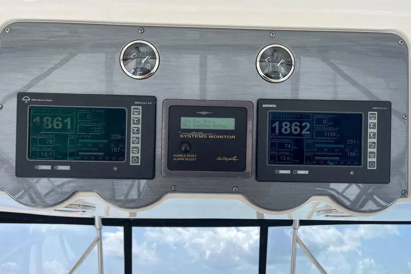 Slide: The Image of Control panel of a 2006 Sea Ray 52 Sedan Bridge with digital displays and gauges. - 19