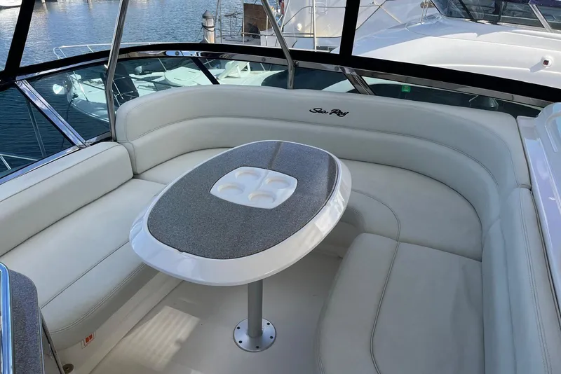 Slide: The Image of Luxurious seating area on 2006 Sea Ray 52 Sedan Bridge yacht, featuring elegant design. - 22