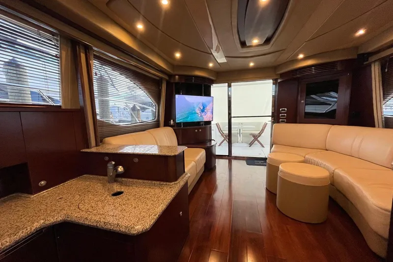 Slide: The Image of Luxurious interior of 2006 Sea Ray 52 Sedan Bridge yacht with elegant seating and modern amenities. - 30