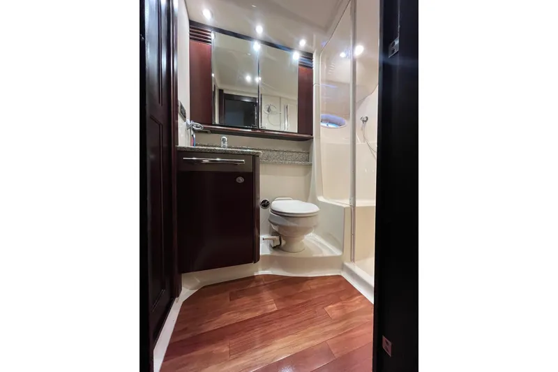 Slide: The Image of Luxurious bathroom in 2006 Sea Ray 52 Sedan Bridge yacht with wood flooring. - 40