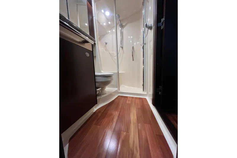 Slide: The Image of Luxurious bathroom interior of 2006 Sea Ray 52 Sedan Bridge yacht with wood flooring. - 41