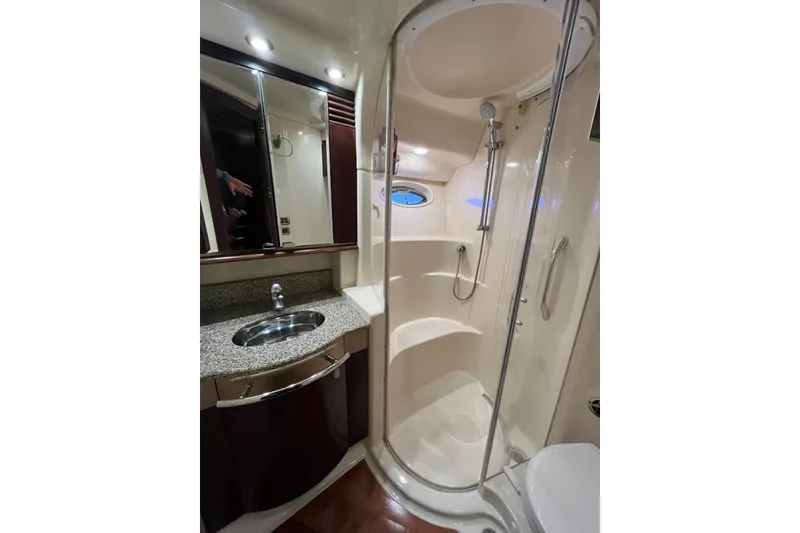Slide: The Image of Luxurious bathroom in 2006 Sea Ray 52 Sedan Bridge yacht with shower and sink. - 42
