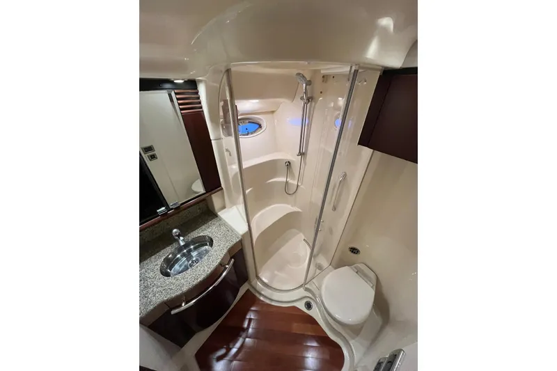 Slide: The Image of Luxurious bathroom in 2006 Sea Ray 52 Sedan Bridge yacht with shower, sink, and toilet. - 46
