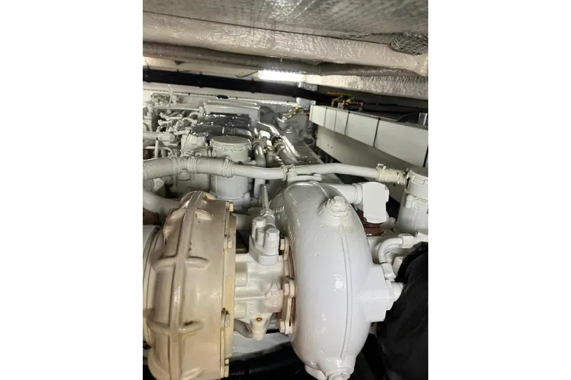 Slide: The Image of Engine room of 2006 Sea Ray 52 Sedan Bridge yacht, showcasing mechanical components. - 51