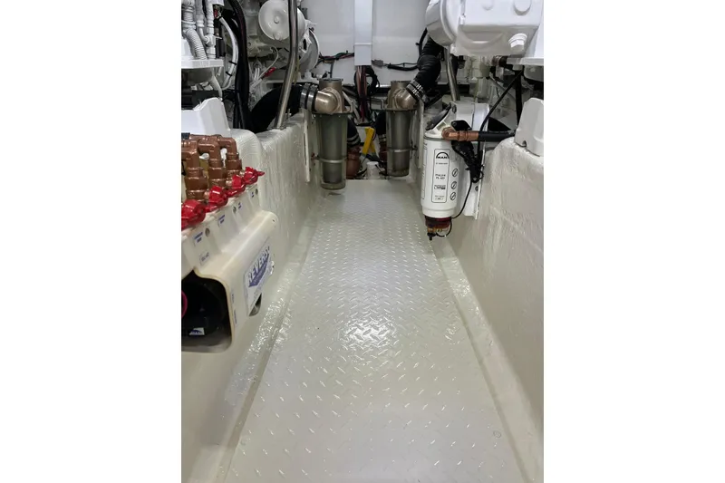 Slide: The Image of Engine room of 2006 Sea Ray 52 Sedan Bridge yacht, showcasing mechanical components. - 54