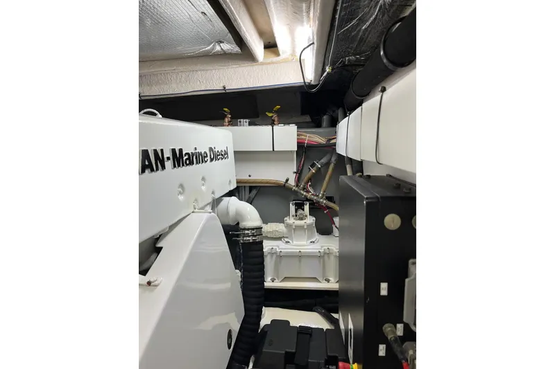 Slide: The Image of Engine room of 2006 Sea Ray 52 Sedan Bridge with marine diesel components. - 56