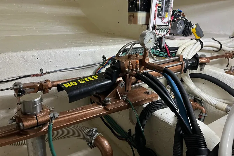 Slide: The Image of Engine room of 2006 Sea Ray 52 Sedan Bridge with hydraulic and electrical components. - 61