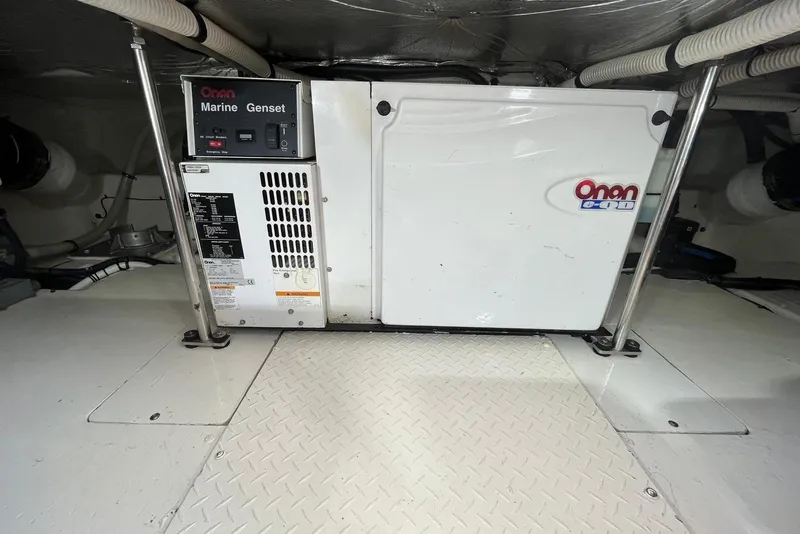 Slide: The Image of Onan marine generator in 2006 Sea Ray 52 Sedan Bridge engine room. - 63