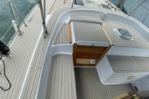 Slide: The Image of 1987 Morgan Classic 41 sailboat deck with wooden accents and sleek design. - 7