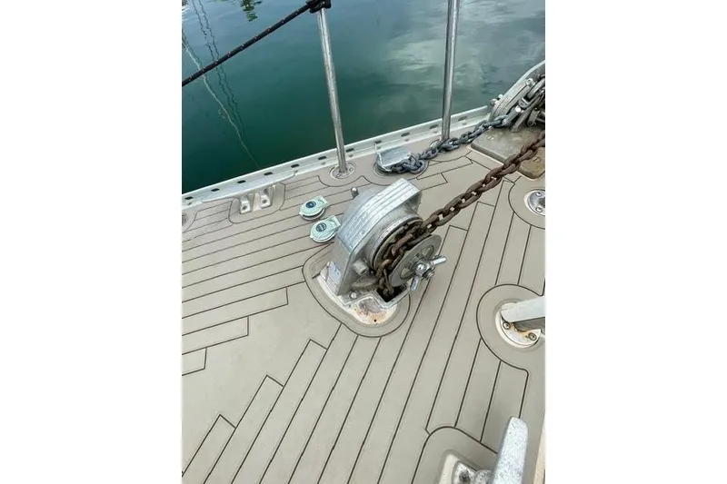 Slide: The Image of Deck of 1987 Morgan Classic 41 sailboat with anchor chain and winch. - 8
