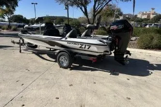 Slide: The Image of 2026 Nitro Z17 boat on trailer in sunny outdoor setting. - 1