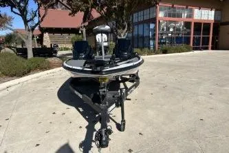 Slide: The Image of 2026 Nitro Z17 boat parked outdoors near a building. - 2
