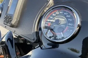 Slide: The Image of Close-up of Nitro Z17 motorcycle speedometer, 2026 model, showing detailed gauge design. - 4