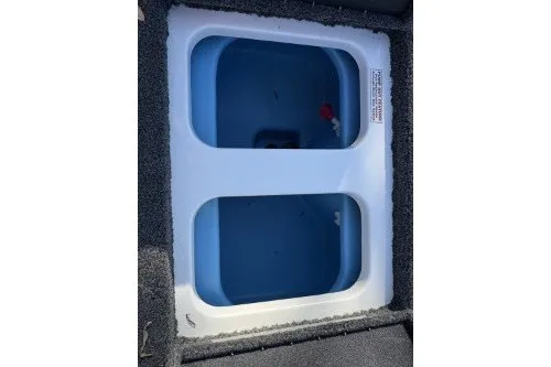 Slide: The Image of 2026 Nitro Z17 boat livewell with dual compartments and blue interior. - 9