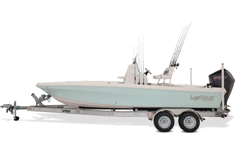 Slide: The Image of 2026 Mako 24 APEX boat parked outdoors, rear view with motor and trailer. - 4