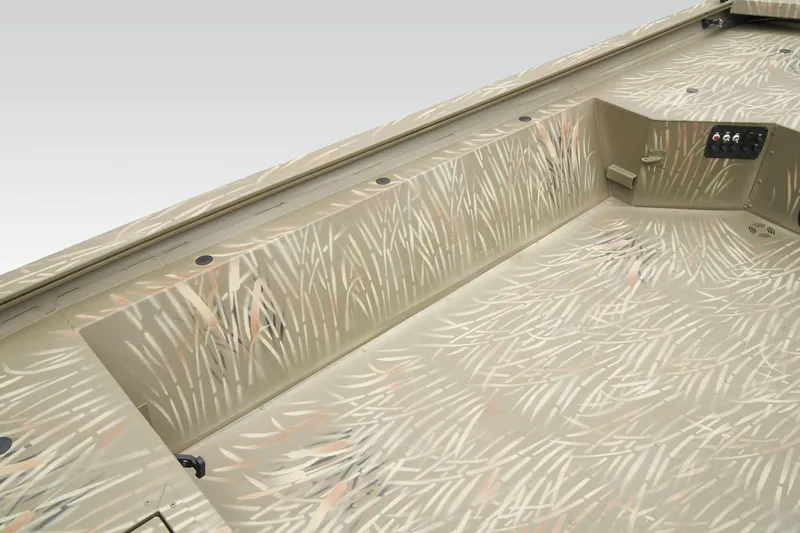 Slide: The Image of 2026 Tracker Grizzly 1654 T Sportsman boat interior with camo design and control panel. - 19