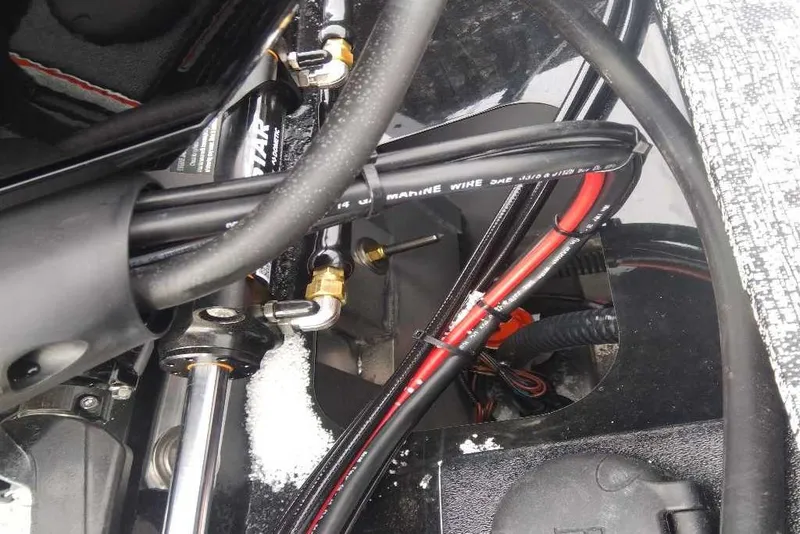 Slide: The Image of Close-up of 2026 Tracker Targa V-18 Combo boat wiring and components. - 76