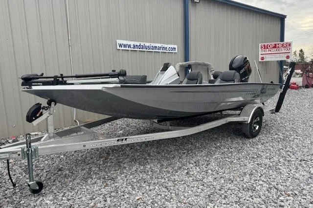 The Image of 2026 Xpress H18 Bass boat on trailer, parked outside Andalusia Marine. - 0