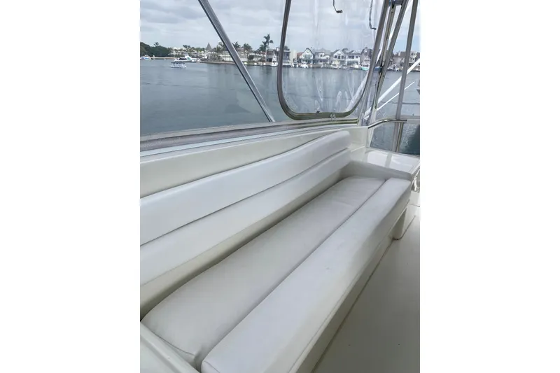 Slide: The Image of White seating area on 1995 Hatteras 50 Convertible Sportfish yacht, overlooking marina. - 39