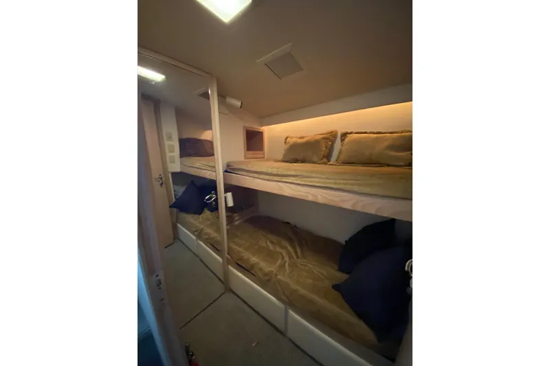 Slide: The Image of Interior of 1995 Hatteras 50 Convertible Sportfish with cozy bunk beds. - 54