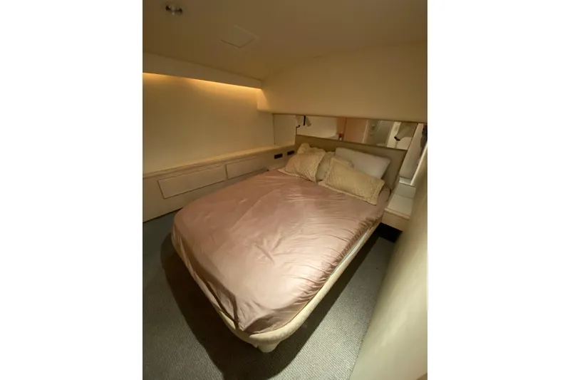 Slide: The Image of Cozy bedroom interior of 1995 Hatteras 50 Convertible Sportfish yacht. - 57